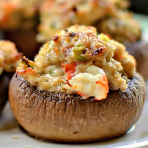 Impress your dinner guests with this easy and delicious recipe for Crab Suffed Mushrooms. These savory appetizers are made with cream cheese, fresh crab meat, Parmesan cheese, and herbs for a flavorful bite. 

