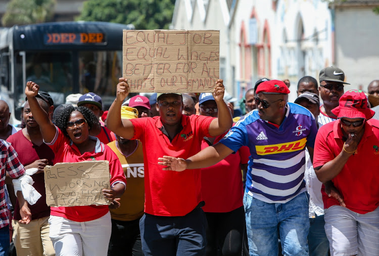 Workers from the Nelson Mandela Metro Safety and Security Directorate protested outside the City Hall on Tuesday. They marched from Mount road to City Hall where they handed over a memorandum to the petitions officer.