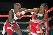 Smangele Hadebe, left, and Ellen Simwaka exchange blows in their previous fight. They meet again on Saturday.