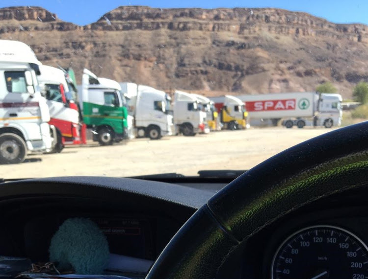 Trucks wait at Vioolsdrift border post, between South Africa and Namibia, after immigration officials staged a protest over lack of water on May 13 2020.