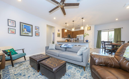 Living room with open kitchen and dining area - Buy this luxury property in Tucson, 3 bedrooms