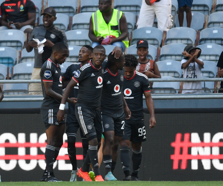 Orlando Pirates midfielder Monnapule Saleng is mobbed by teammates after he opened the scoring in the DStv Premiership match against Golden Arrows at Orlando Stadium.