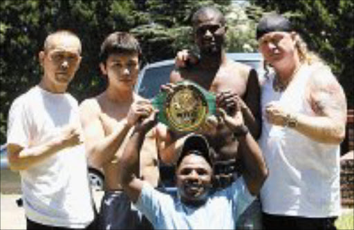 RUMBLE: Yoshinori Miyata and Jeffrey Mathebula are flanked by the Japanese boxer's trainer, Yoshutami Januka and the Mongoose's manager, Nick Durandt. Holding the WBC international belt is promoter Jacob Matlala . Pic. Mbuzeni Zulu. 18/02/08. © Sowetan.