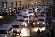 Commuters and taxi's at the Bara taxi rank. File photo.