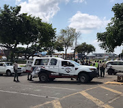 Private security and police outside the Boardwalk Mall in Richards Bay monitoring the situation during the EFF national shutdown.