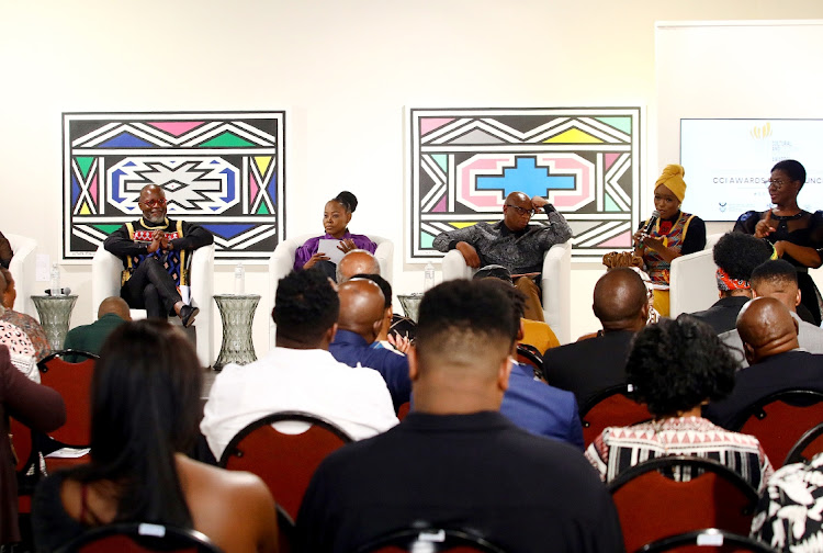 Thebe Ikalafeng, Gauteng MMC Morakane Mosupyoe and Minister of Sports, Arts and Culture, Zizi Kodwa listen to Unathi Nkayi during the official launch of the inaugural Cultural and Creative Industry Awards (CCIAs) “Recognising the brightest stars.” at the Melrose Gallery, Melrose Arch, in Johannesburg.