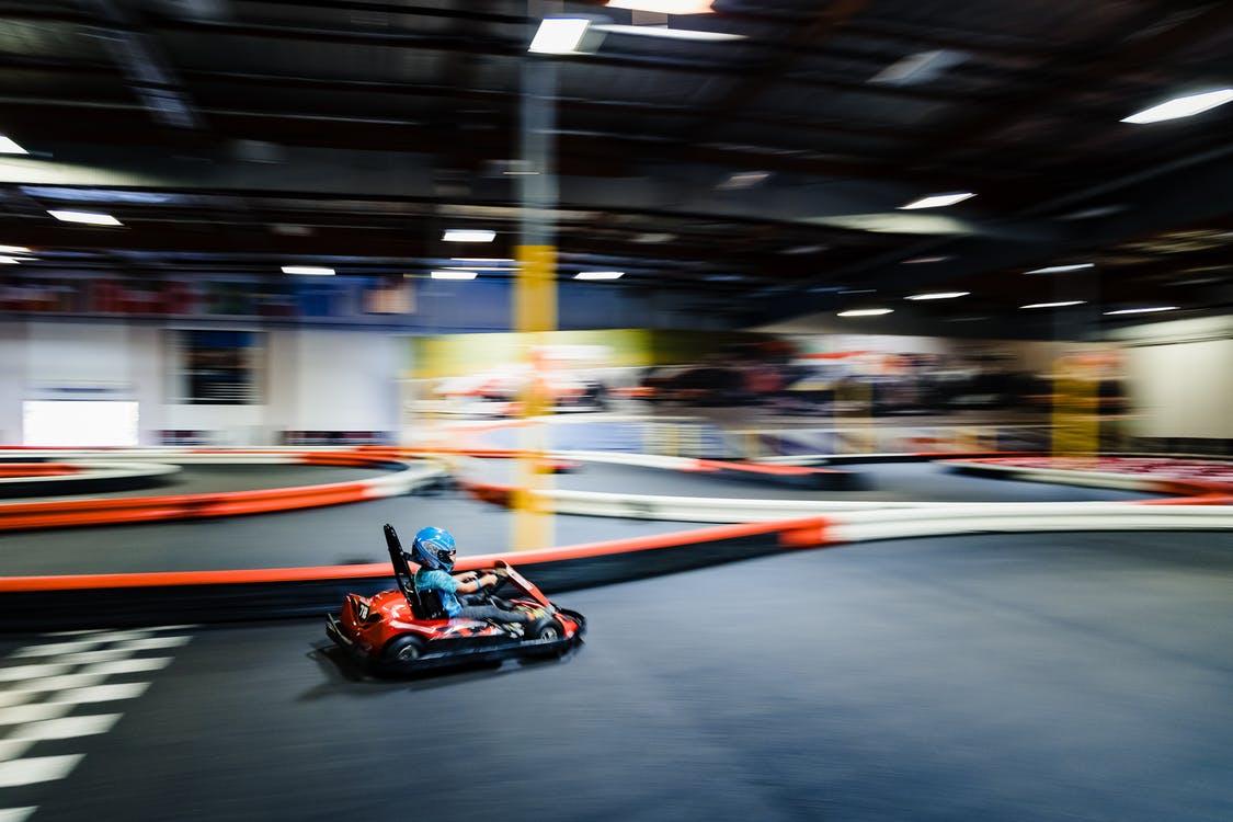 Boy Riding Red Go Kart