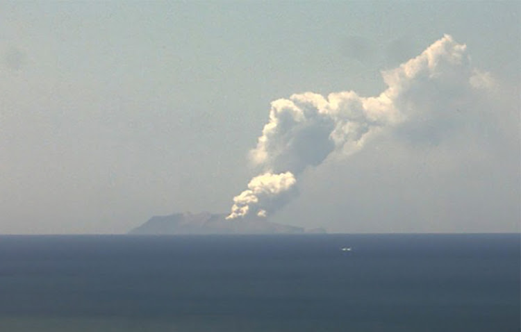 DEADLY ERUPTION: This webcam image from the Institute of Geological and Nuclear Sciences shows the volcano on New Zealand’s White Island spewing steam and ash on Monday