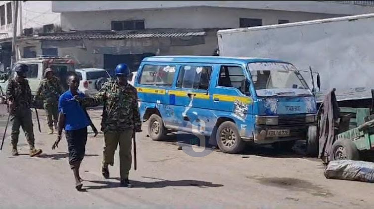 Police and a protester in Express area along Moi Avenue in Mombasa during the Azimio demonstrations on Wednesday, July 19, 2023.