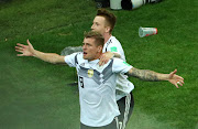 Germany's Toni Kroos celebrates scoring their second goal with Marco Reus.