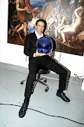 Jeff Koons pictured with one of the pieces in his 'Gazing Ball' series.