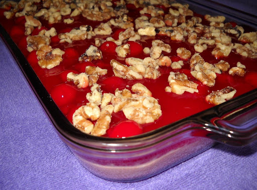 My photo of Mom's special dessert -- made 2-21-2013 for Church supper, with the nuts on top, with pie cherries in the raspberry jello & orange jello on the bottom. Yum!!