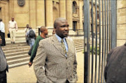 'HIJACKED': Siphiwe Mlaba leaves the Johannesburg high court after testifying how the men accused of killing reggae star Lucky Dube had hijacked him two days later.  05/02/2009. Pic. Vathiswa Ruselo. © Sowetan.