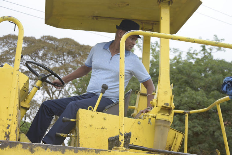 Thika Town MP Patrick Wainaina during an inspection of the Nampack-Umoja-Mid Oil link road in Thika on Saturday.