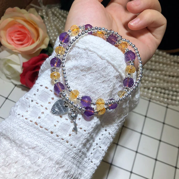 Citrien-Amethist dubbellaagse armband, voor harmonie en balans. Ervaar de krachtige combinatie van citrien en amethist in een elegant ontwerp.