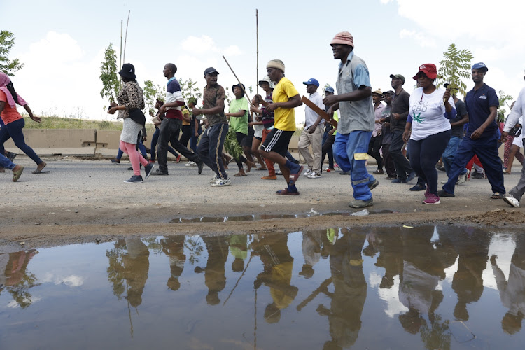 The community of Diepsloot, north of Johannesburg, protests over the high crime rate in the informal settlement.