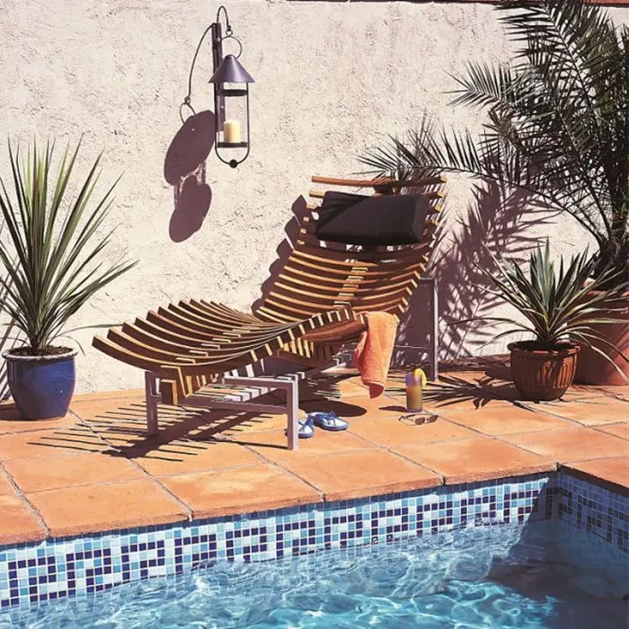 Terracotta tiles around edge of swimming pool