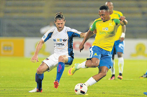 GREAT THINGS AHEAD: Sibusiso Vilakazi of Mamelodi Sundowns tries to keep the ball away from Marc van Heerden of Chippa United during their MTN 8 semi final second leg match in Pretoria yesterday Picture: GALLO IMAGES