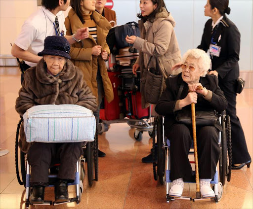 Lee Ok-seon (R) and Kang Il-chul arrive in Tokyo, Japan, 25 January 2016, for appearances to testify on their sufferings as 'comfort women.' South Korea and Japan on 28 December 2015, reached an agreement to fully resolve the issue over women like Lee and Kang, who were forced into sexual slavery for Japanese soldiers during World War II when Korea was under Japan's colonial rule. Despite the agreement, many of the victims refuse to accept the terms of the deal, which includes a support fund for the victims, arguing that Tokyo has yet to fully atone for the crime.