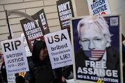 Supporters of Julian Assange protest outside court before an extradition hearing at The City of Westminster Magistrates Court on April 20, 2022 in London, England. The Wikileaks founder faces extradition to the US and conspiracy and hacking charges, which he denies. 