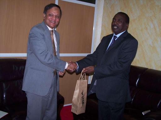 Former Pakistan High commissioner to Kenya Rafiuzzaman Siddiqui and former Kirinyaga county governor Joseph Ndathi when the commissioner paid a courtesy call in his office. FILE