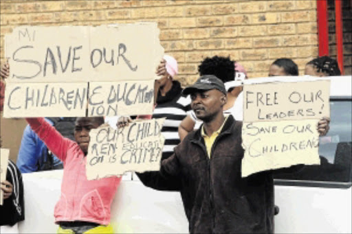 SUFFER THE CHILDREN: Residents of Klarinet near Witbank protest over problems with the scholar transport, which mean many of their children are unable to attend school Photo: Veli Nhlapo