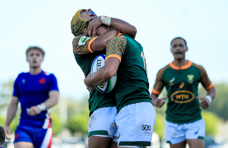 SA's Imad Khan celebrates with teammates after scoring a try during the U20 Six Nations Summer Series Pool A match against France in Verona, Italy.