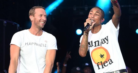 Chris Martin, left, with Pharrell Williams at the Global Citizen Festival at FNB Stadium on Sunday, December 2.