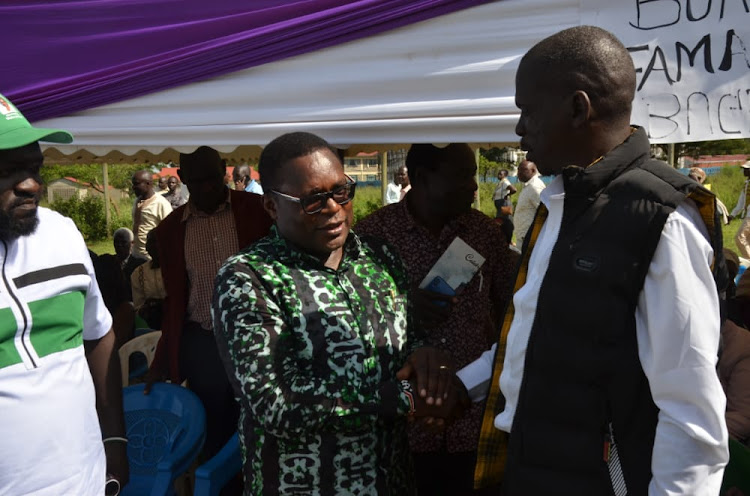 Senate Speaker Ken Lusaka with activist Wafula Buke during the funeral of Buke's wife in Bungoma town.