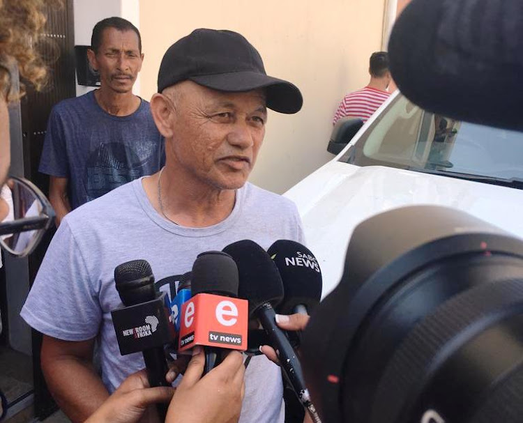 Murdered Hard Livings gang boss Rashied Staggie's younger brother Solomon speaks to the media outside his brother's house on December 13 2019.