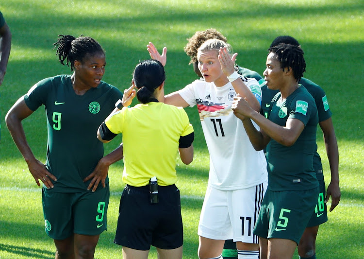 Germany's Alexandra Popp appeals to referee Yoshimi Yamashita