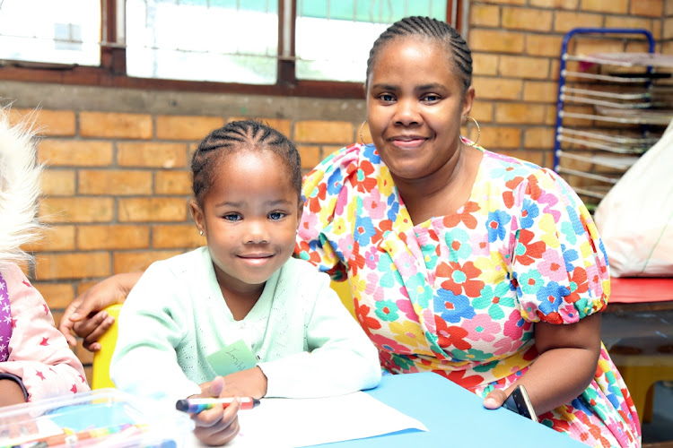 Imihlali Nkatazo with her mom, Yolanda, ready for the start of grade RR at Cambridge Primary School, East London.