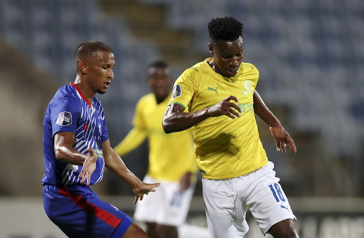 Themba Zwane of Mamelodi Sundowns is challenged by Nazeer Allie of Maritzburg United in the DStv Premiership match at Harry Gwala Stadium in Petermaritzburg on the March 5 2022.