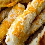 Cheesy Garlic Breadsticks was pinched from <a href="http://sallysbakingaddiction.com/2014/02/12/cheesy-garlic-breadsticks/" target="_blank">sallysbakingaddiction.com.</a>