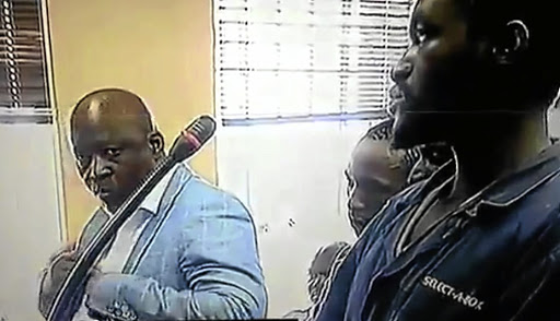 Mike Mangena and his co-accused in court.