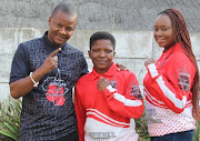 Boxing promoter Mahlatsi Sediane, right, husband and manager Michael Sediane with some if their fighter whe will be in action on September 16. 
