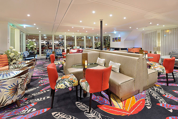 Relax, order a drink or enjoy delicious tapas between meals in the Main Lounge on AmaLea. 