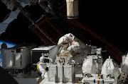 In this photo provided by NASA, Astronaut Christopher Cassidy, STS-127 mission specialist, handles the Japanese Experiment Module - Exposed Facility, which has been a major subject of attention by the joint crews aboard the International Space Station July 22, 2009 in Space. Flight day 8 saw both hands-on and robotics work with the new hardware. Endeavour is on a 16-day mission with the crew of STS-127 that will include five spacewalks and complete construction of the Japan Aerospace Exploration Agency's Kibo laboratory.