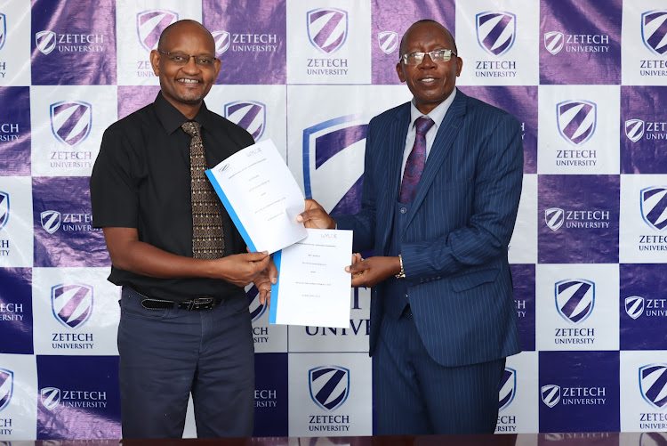 Zetech Vice Chancellor Prof Njenga Munene (right) with Wylde International Director Kiriinya Kithinji after signing the MoU.