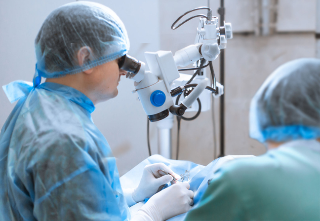 Surgeon being trained to perform microsurgery