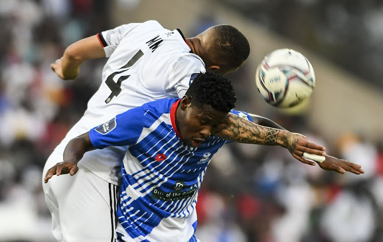 Miguel Timm of Orlando Pirates and Karim Kimvuidi of Maritzburg United challenge for an aerial ball in the DStv Premiership match at Harry Gwala Stadium in Pietermaritzburg on September 4 2022.