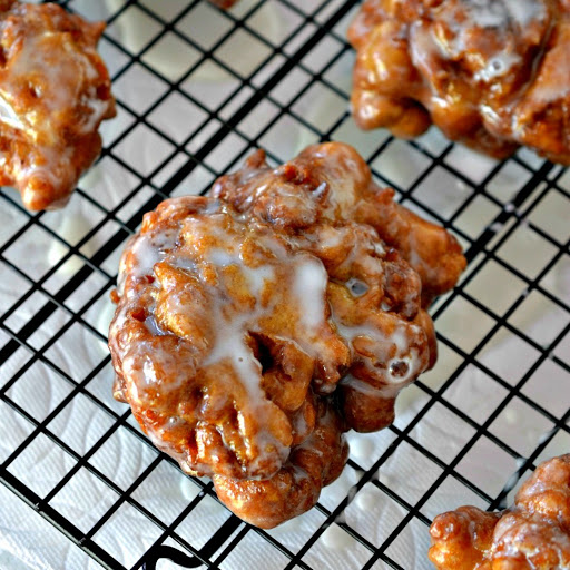 Apple Fritters are luscious deep fried donuts filled with apples, cinnamon and drizzled with an easy three ingredient glaze. 