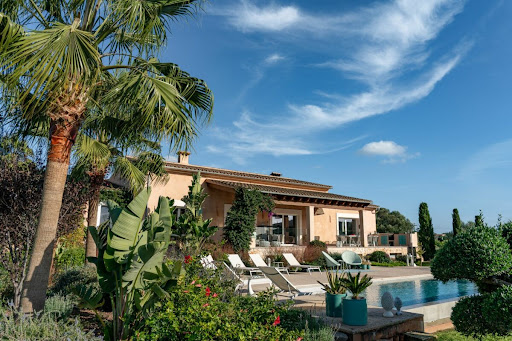 Buy this luxury villa in Son Carrió (Spain) - Modern house with pool and palm trees