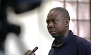 Refugee leader JP Balous in the dock at the Cape Town magistrate's court on Friday.