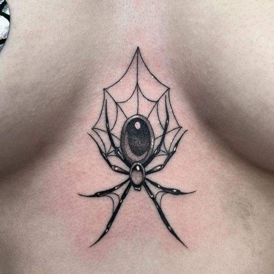 Another look of a lady rocking the tat on her sternum