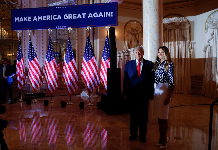 Former US President Donald Trump stands with his wife, former first lady Melania Trump as they arrive for his announcement that he will once again run for US president in the 2024 US presidential election, during an event at in Palm Beach, Florida, U.S. November 15, 2022.