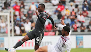 Thabang Monare of Orlando Pirates tackled by Waseem Isaacs of Swallows during their DStv Premiership match at Orlando Stadium, Johannesburg on 06 August 2022.