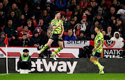 Declan Rice celebrates scoring Arsenal's fifth goal with Jakub Kiwior in their Premier League win against Sheffield United at Bramall Lane in Sheffield on Monday night.