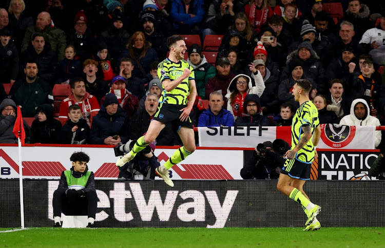 Declan Rice celebrates scoring Arsenal's fifth goal with Jakub Kiwior in their Premier League win against Sheffield United at Bramall Lane in Sheffield on Monday night.