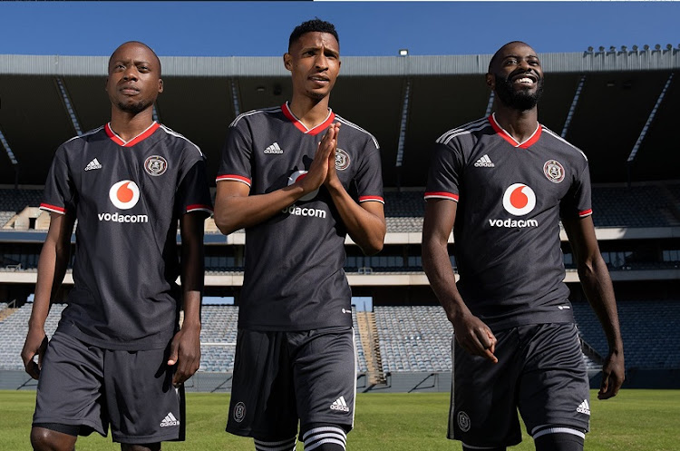 Players Ben Motswhari, Vincent Pule and Deon Hotto display Orlando Pirates' new adidas kit for the 2022-2023 season at Orlando Stadium.